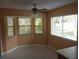 Breakfast nook with bay window and ceiling fan at 32525 Oak Park Dr, Leesburg, FL 34748