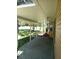 Covered patio with paver stones and backyard view at 32525 Oak Park Dr, Leesburg, FL 34748
