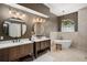Elegant bathroom with double vanity, soaking tub, and large mirrors at 858 Creston Dr, Maitland, FL 32751
