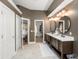Double vanity bathroom with walk-in closet and bedroom access at 858 Creston Dr, Maitland, FL 32751