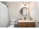 Clean bathroom with a round mirror and single vanity at 858 Creston Dr, Maitland, FL 32751