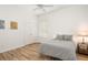Serene bedroom with striped bedding and window blinds at 858 Creston Dr, Maitland, FL 32751