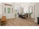 Bright dining room features a large table, chandelier, and hardwood floors at 858 Creston Dr, Maitland, FL 32751