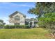 Two-story house with a well-maintained lawn and mature trees at 858 Creston Dr, Maitland, FL 32751