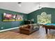 Game room features a pool table, large TV's, and comfortable seating at 858 Creston Dr, Maitland, FL 32751
