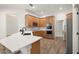 Updated kitchen featuring light wood cabinets and breakfast bar at 858 Creston Dr, Maitland, FL 32751