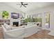 Living room boasts a fireplace, built-ins, and pool view at 858 Creston Dr, Maitland, FL 32751
