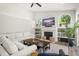 Spacious living room with a fireplace and large windows at 858 Creston Dr, Maitland, FL 32751