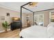 Main bedroom with king-size bed, access to the pool, and plenty of natural light at 858 Creston Dr, Maitland, FL 32751