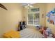 Bright playroom with toys and large window at 858 Creston Dr, Maitland, FL 32751