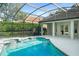 Inviting pool area with covered patio and spa at 858 Creston Dr, Maitland, FL 32751