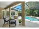 Relaxing screened-in pool area with patio furniture at 858 Creston Dr, Maitland, FL 32751