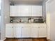 White kitchen with granite countertops and appliances at 544 S Cottage Hill Rd, Orlando, FL 32805