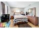 Primary bedroom with a double bed and wood dresser at 544 S Cottage Hill Rd, Orlando, FL 32805