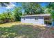 Back of house with grassy backyard at 544 S Cottage Hill Rd, Orlando, FL 32805