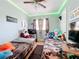 bedroom with twin beds, TV, and plenty of toys at 544 S Cottage Hill Rd, Orlando, FL 32805