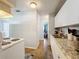 Kitchen hallway view with partial kitchen and bedroom view at 544 S Cottage Hill Rd, Orlando, FL 32805