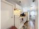 Bright kitchen features white appliances and tile floor at 544 S Cottage Hill Rd, Orlando, FL 32805