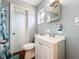 Clean bathroom with white vanity, toilet and shower at 544 S Cottage Hill Rd, Orlando, FL 32805