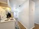 Kitchen hallway with view into another room at 544 S Cottage Hill Rd, Orlando, FL 32805