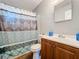 Clean bathroom with shower/tub combo and wood vanity at 544 S Cottage Hill Rd, Orlando, FL 32805