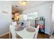 Small dining area with white table and chairs at 544 S Cottage Hill Rd, Orlando, FL 32805