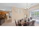 Dining area with table and chairs, kitchen and balcony access at 3174 Feltrim Pl # 201, Kissimmee, FL 34747