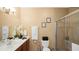 Clean bathroom with a large vanity, shower, and neutral color palette at 3174 Feltrim Pl # 201, Kissimmee, FL 34747