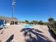 Inviting community pool with lounge chairs and patio area at 3174 Feltrim Pl # 201, Kissimmee, FL 34747