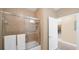 Clean bathroom with shower/tub combo and tiled walls at 3174 Feltrim Pl # 201, Kissimmee, FL 34747