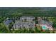 Aerial view of apartment complex with pool and surrounding area at 3174 Feltrim Pl # 201, Kissimmee, FL 34747