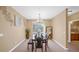 Dining room with table, chairs, and access to a balcony at 3174 Feltrim Pl # 201, Kissimmee, FL 34747