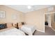 Guest bedroom with two twin beds and access to hallway at 3174 Feltrim Pl # 201, Kissimmee, FL 34747