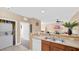 Kitchen with double sink, dishwasher, and laundry closet at 3174 Feltrim Pl # 201, Kissimmee, FL 34747
