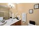 Clean bathroom with a large vanity, shower, and neutral color palette at 3174 Feltrim Pl # 201, Kissimmee, FL 34747