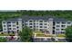 Exterior view of a three-story apartment building with parking at 3174 Feltrim Pl # 201, Kissimmee, FL 34747