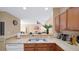 Kitchen boasts double sink, ample counter space and views to living area at 3174 Feltrim Pl # 201, Kissimmee, FL 34747