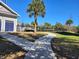 Community pool area with walkway and lush landscaping at 3174 Feltrim Pl # 201, Kissimmee, FL 34747