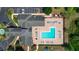 Aerial view of community pool and clubhouse with surrounding landscape at 3174 Feltrim Pl # 201, Kissimmee, FL 34747