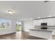 Kitchen with island, stainless steel appliances, and sliding glass doors at 2130 Judith Ct, Haines City, FL 33844