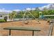Community playground with play structures and benches at 2874 Stanza Ct, Kissimmee, FL 34746