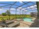 Private screened pool and spa with lounge chairs at 2874 Stanza Ct, Kissimmee, FL 34746