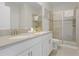 Bathroom with double vanity, shower, and toilet at 2874 Stanza Ct, Kissimmee, FL 34746