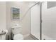Bathroom with a walk-in shower and white tile at 2874 Stanza Ct, Kissimmee, FL 34746