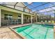 Resort-style pool with spa and screened enclosure at 2874 Stanza Ct, Kissimmee, FL 34746