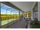 Screened patio with outdoor dining and pool access at 2874 Stanza Ct, Kissimmee, FL 34746