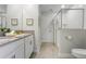 Double vanity bathroom with gray counters and a walk-in shower at 2874 Stanza Ct, Kissimmee, FL 34746