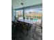 Covered patio with outdoor dining furniture overlooking the pool at 2442 Tangier Dr, Kissimmee, FL 34747