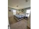 Large bedroom with king-size bed and stone accent wall at 2442 Tangier Dr, Kissimmee, FL 34747