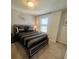 Bedroom with queen-size bed and gray and black bedding at 2442 Tangier Dr, Kissimmee, FL 34747